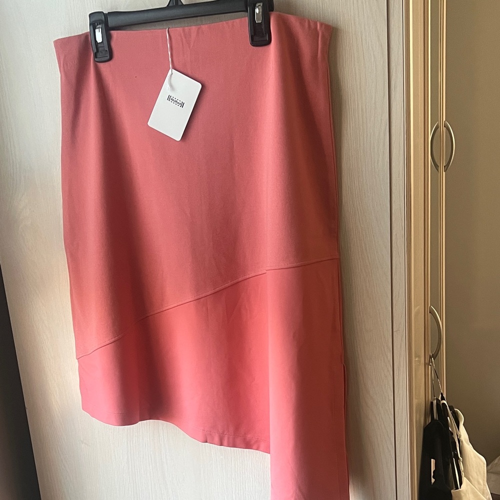 Wolford asymmetrical skirt 
Color is Coral